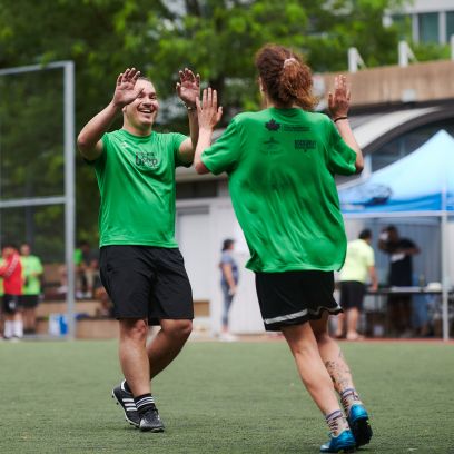 Two team members congratulating each other.